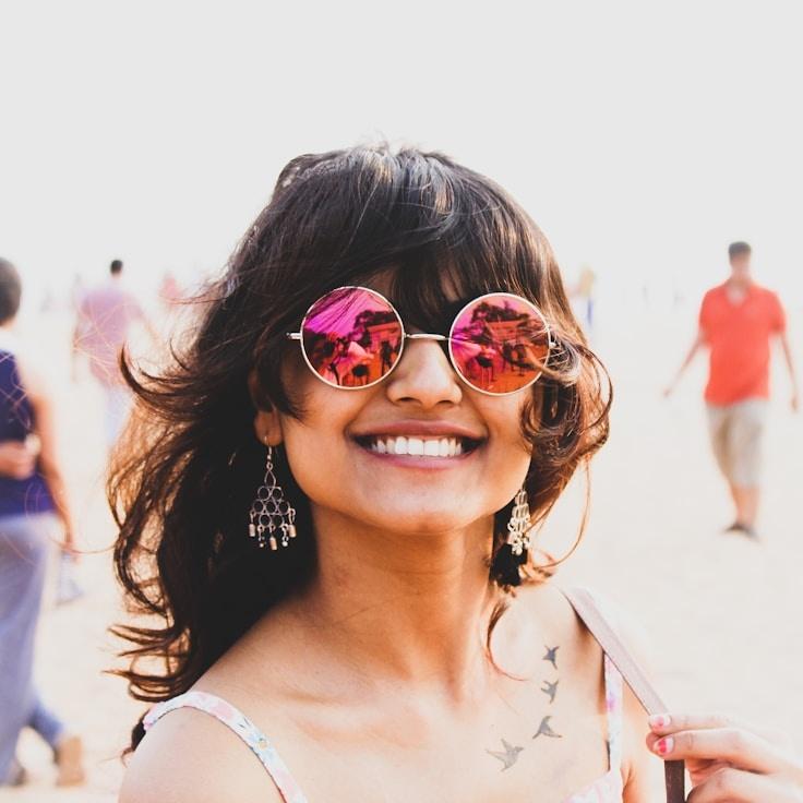 Avery Singh, Lead Design Curator at Blue Canyon Hub, reviewing corporate floral arrangements